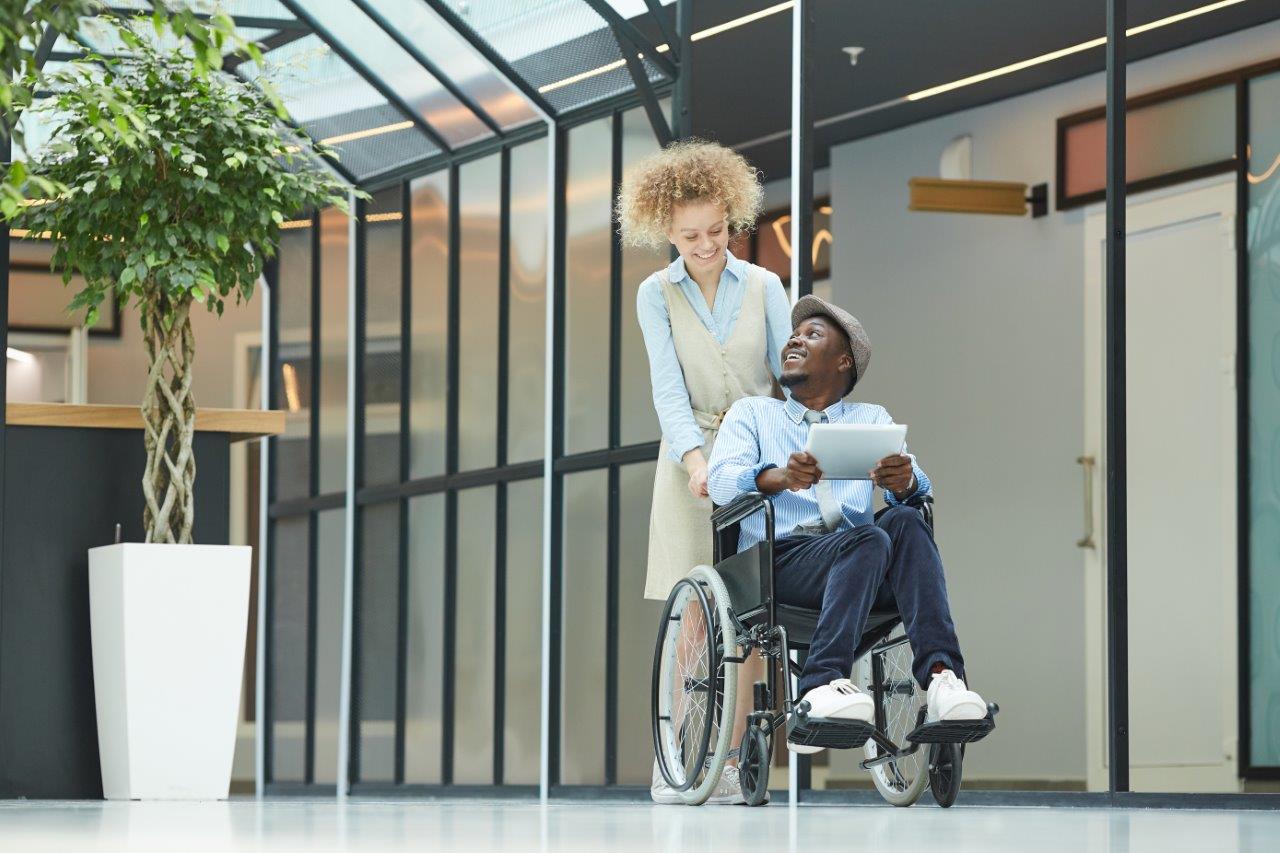 A wheelchair user with a companion